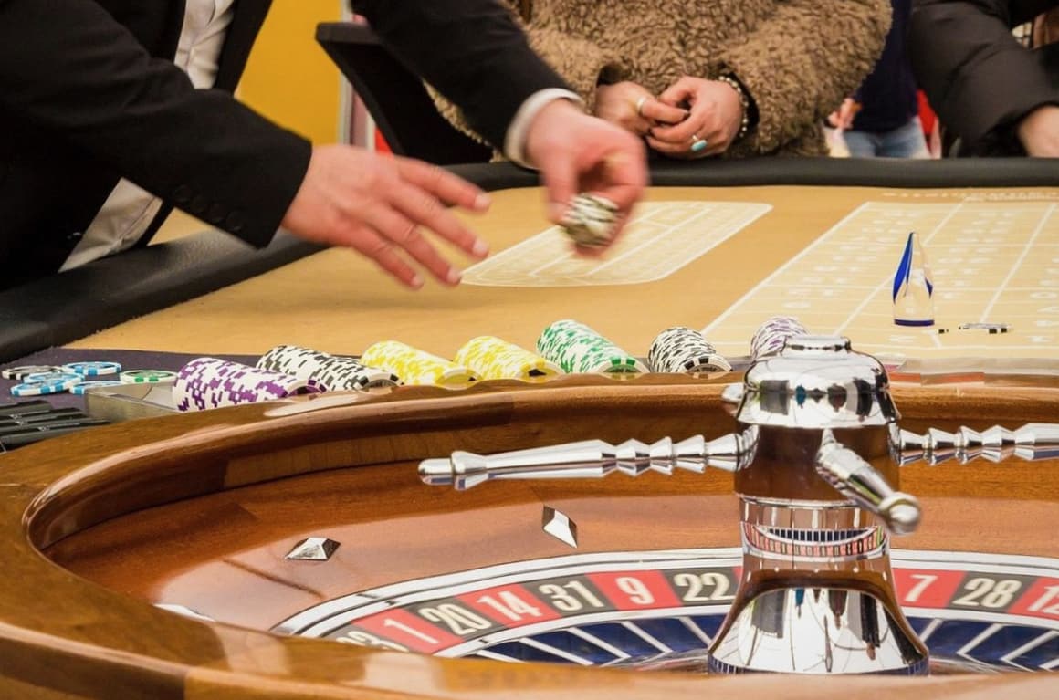Guests gathered around a felt game table