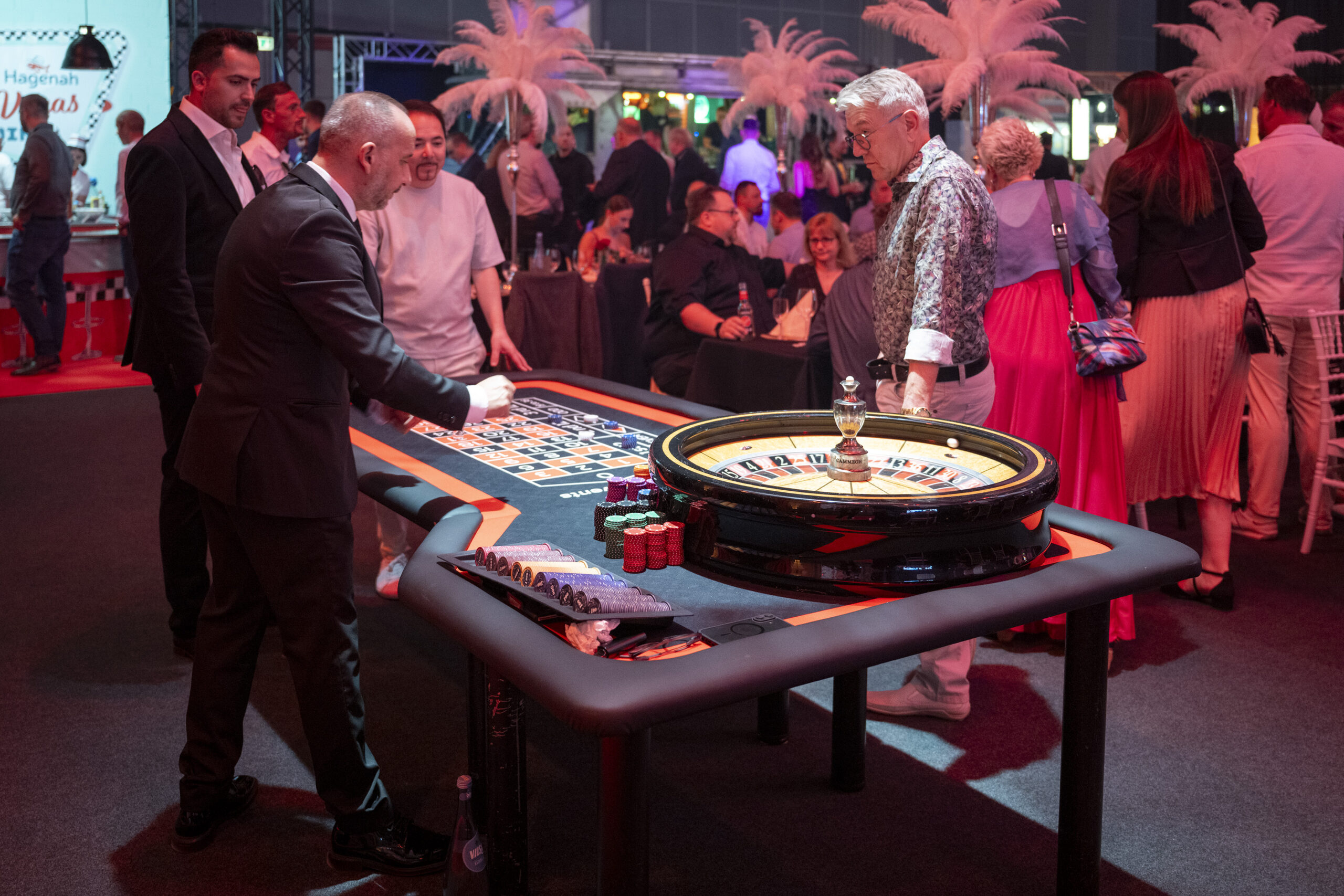 A group of guests enjoying a private game night around a table